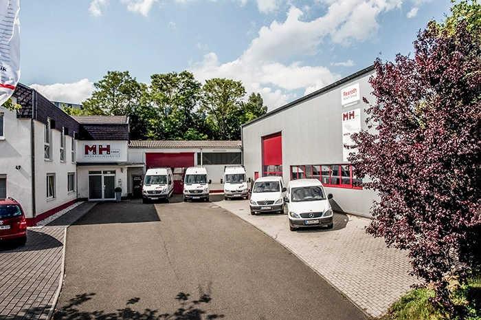 MH-Hydraulikservice GmbH — Firmengebäude und Team